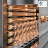 Infrared heating lamps preheating PET preforms in a blow molding machine