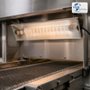Infrared heating module installed above an industrial conveyor system